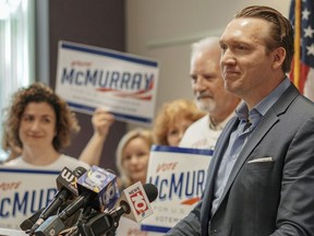 In this Aug. 9, 2018 photo, provided by Nate McMurray for Congress, Nate McMurray, the Democrat who is running in the 27th Congressional District, speaks to supporters in Rochester, N.Y., the day after his opponent, U.S. Rep. Christopher Collins, R-N.Y., was arrested on insider trading charges. On Saturday, Aug. 11, 2018, Collins said he would end his re-election bid, while McMurray called on Collins to resign. (Nate McMurray for Congress via AP)