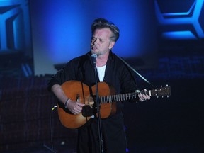 FILE - In this Thursday, June 14, 2018, file photo, John Mellencamp performs on stage during the 49th annual Songwriters Hall of Fame Induction and Awards gala at the New York Marriott Marquis Hotel in New York. The Butler Institute of American Art in Youngstown, Ohio, has announced a new exhibition of paintings by rocker John Mellencamp, known for his expressionistic oil portraits and other works. "John Mellencamp: Expressionist" opens Sept. 20 and runs through Nov. 18. It will include portraits and mixed-media pieces.