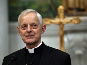 File- This June 30, 2015, file photo shows Cardinal Donald Wuerl, archbishop of Washington, speaking during a news conference at the Cathedral of St. Matthew the Apostle in Washington.  Wuerl, archbishop of Washington, is defending himself ahead of a forthcoming grand jury report investigating child sexual abuse in Pennsylvania's Roman Catholic dioceses that he says will be critical of his actions as Pittsburgh's bishop.