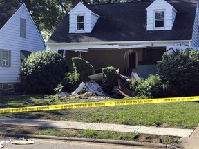 This photo provided by WEWS-TV in Cleveland shows the home in South Euclid, Ohio, where two brothers were found dead of self-inflicted gun shot wounds Aug. 11. Kevin Nietert, police chief in the Cleveland suburb of South Euclid says he can only speculate why 31-year-old Michael Warn and 29-year-old Mark Warn would have killed 59-year-old Dr. Richard Warn at the podiatrist's home in Beachwood, an upscale Cleveland suburb.