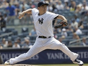 New York Yankees starting pitcher Masahiro Tanaka throws during the first inning of a baseball game against the Tampa Bay Rays at Yankee Stadium Thursday, Aug. 16, 2018, in New York.