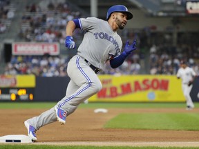 Toronto Blue Jays' Devon Travis runs to home plate on a single by Kendrys Morales during the first inning of a baseball game against the New York Yankees, Friday, Aug. 17, 2018, in New York.