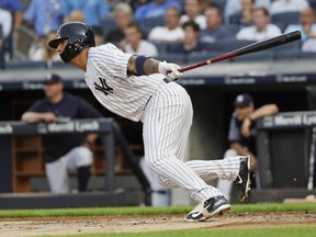 New York Yankees' Gleyber Torres hits an RBI single during the first inning of a baseball game against the Baltimore Orioles Tuesday, July 31, 2018, in New York.