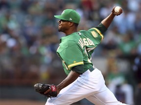 Oakland Athletics pitcher Edwin Jackson works against the Houston Astros in the first inning of a baseball game Friday, Aug. 17, 2018, in Oakland, Calif.