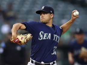 Seattle Mariners pitcher Marco Gonzales works against the Oakland Athletics in the first inning of a baseball game Monday, Aug. 13, 2018, in Oakland, Calif.