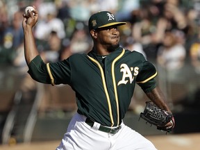 Oakland Athletics pitcher Edwin Jackson throws to a Detroit Tigers batter during the first inning of a baseball game in Oakland, Calif., Saturday, Aug. 4, 2018.