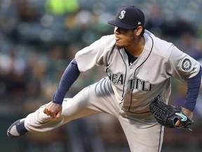 Seattle Mariners pitcher Felix Hernandez works against the Oakland Athletics in the first inning of a baseball game Tuesday, Aug. 14, 2018, in Oakland, Calif.