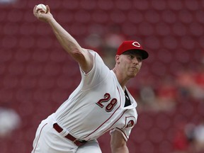 Cincinnati Reds starting pitcher Anthony DeSclafani throws to a San Francisco Giants batter during the first inning of a baseball game Friday, Aug. 17, 2018, in Cincinnati.