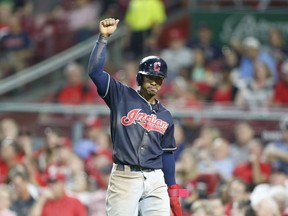 Cleveland Indians' Francisco Lindor reacts after scoring on a single by Melky Cabrera, off Cincinnati Reds relief pitcher Amir Garrett during the sixth inning of a baseball game, Monday, Aug. 13, 2018, in Cincinnati.