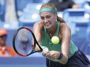 Petra Kvitova, of the Czech Republic, returns to Kiki Bertens, of the Netherlands, in a semi-final match at the Western & Southern Open tennis tournament, Saturday, Aug. 18, 2018, in Mason, Ohio.