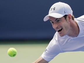 Andy Murray, of Great Britain, chases down a return from Lucas Pouille, of France, in the first round at the Western & Southern Open, Monday, Aug. 13, 2018, in Mason, Ohio.