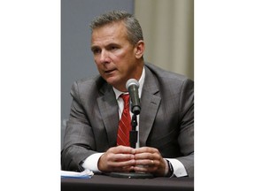 Ohio State football coach Urban Meyer answers questions during a news conference in Columbus, Ohio, Wednesday, Aug. 22, 2018. Ohio State suspended Meyer on Wednesday for three games for mishandling domestic violence accusations, punishing one of the sport's most prominent leaders for keeping an assistant on staff for several years after the coach's wife accused him of abuse. Athletic director Gene Smith was suspended from Aug. 31 through Sept. 16.