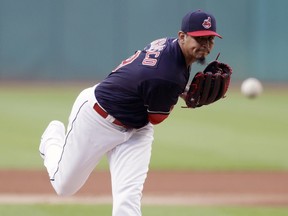 Cleveland Indians starting pitcher Carlos Carrasco delivers in the first inning of a baseball game against the Minnesota Twins, Tuesday, Aug. 28, 2018, in Cleveland.