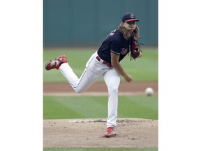 Cleveland Indians starting pitcher Mike Clevinger delivers in the first inning of the team's baseball game against the Minnesota Twins, Wednesday, Aug. 8, 2018, in Cleveland.