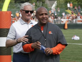 Cleveland Browns owner Jimmy Haslam, left and head coach Hue Jackson watch during NFL football training camp, Monday, July 30, 2018, in Berea, Ohio.
