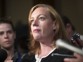 Lisa Macleod, Ontario's Children, Community and Social Services Minister, talks with the media after Question Period at the Ontario Legislature in Toronto on Thursday, August 2, 2018.