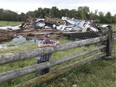 Friends and family gathered at Rob and Debbie Campbell's farm at 2997 McLachlin Rd. near Smiths Falls on Wednesday Aug 29, 2018 after an apparent microburst flattened two barns.