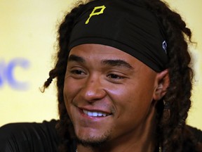 Pittsburgh Pirates pitcher Chris Archer, newly acquired from the Tampa Bay Rays, talks with reporters at PNC Park after a long toss workout before a baseball game against the Chicago Cubs in Pittsburgh, Wednesday, Aug. 1, 2018.