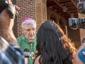 FILE- In this Saturday, Aug. 18, 2018, file photo Bishop David Zubik, current Bishop of the Catholic Diocese of Pittsburgh, takes questions from reporters after vocation Mass at Saints John and Paul Parish in Franklin Park, Pa. Zubik, the bishop of Pittsburgh's Roman Catholic diocese, is pushing back against a call for his resignation and says the diocese has "followed every single step" needed for responsible action after allegations of child sexual abuse.