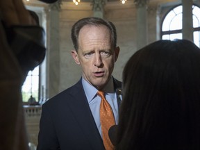 FILE – In this May 18, 2017, file photo, U.S. Sen. Pat Toomey, R-Pa., responds to questions on Capitol Hill in Washington. Google has alerted Toomey's office that hackers with ties to a "nation-state" sent phishing emails to old campaign email accounts, a spokesman for Toomey said Friday, Aug. 24, 2018.