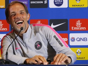 PSG's coach Thomas Tuchel laughs during a press conference at the club training center in Saint Germain en Laye, west of Paris, Friday, Aug.17, 2018. Paris Saint Germain will play Guingamp Saturday in a French League One match.