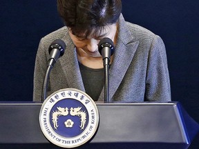 South Korean President Park Geun-Hye bows during an address to the nation on November 29, 2016 in Seoul.