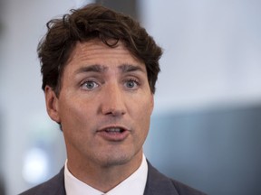 Prime Minister Justin Trudeau responds to a few questions following a meeting with a group of businessmen in Longueuil, Que. on Tuesday, August 28, 2018.