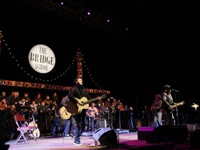 FILE--In this Oct. 23, 2010, file photo, Pearl Jam performs during the Bridge School Benefit concert in Mountain View, Calif. Republicans are condemning a poster by Pearl Jam that shows the White House in flames and a bald eagle pecking at a skeleton they say is meant to depict President Donald Trump.