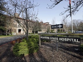 FILE - This April 11, 2017, file photo shows the entrance to Western State Hospital in Lakewood, Wash. A patient with a history of violence was charged with assault Tuesday, Aug. 28, 2018, after he punched a nurse, knocked her to the floor and repeatedly stomped on her head at the Washington state psychiatric hospital that recently lost accreditation and federal funding due to safety violations.