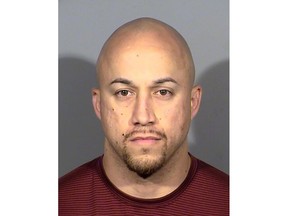 FILE - This undated file photo released by the Las Vegas Metropolitan Police Department shows Kenneth Lopera. Prosecutors in Las Vegas have dropped charges, including involuntary manslaughter, against Lopera, the former Las Vegas police officer accused of using an unapproved chokehold in the death of an unarmed man last year. (Las Vegas Metropolitan Police Department via AP, File)