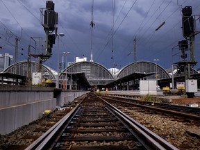 Empty rails are seen outside the main train station In Frankfurt, Germany, Thursday, Aug. 9, 2018. Due to rain falls and thunderstorms trains were cancelled or delayed.