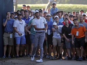 Tony Finau watches his second shot on the 10th hole during the first round of the PGA Championship golf tournament at Bellerive Country Club, Thursday, Aug. 9, 2018, in St. Louis.