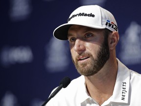 Dustin Johnson responds to a question during a news conference at the PGA Championship golf tournament at Bellerive Country Club, Tuesday, Aug. 7, 2018, in St. Louis.