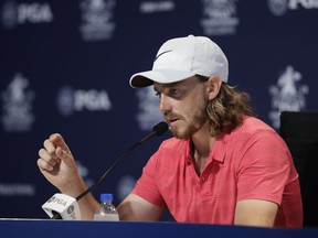 Tommy Fleetwood, of England, responds to a question during a news conference at the PGA Championship golf tournament at Bellerive Country Club, Wednesday, Aug. 8, 2018, in St. Louis.