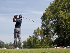 Tiger Woods watches his tee shot on the second hole during the first round of the PGA Championship golf tournament at Bellerive Country Club, Thursday, Aug. 9, 2018, in St. Louis.