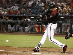 Arizona Diamondbacks' Patrick Corbin connects for a two-run single against the San Francisco Giants during the first inning of a baseball game Friday, Aug. 3, 2018, in Phoenix.