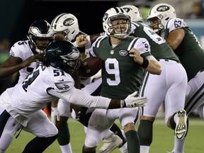 Philadelphia Eagles' Steven Means (51) knocks the ball loose from New York Jets' John Wolford (9) during the second half of a preseason NFL football game Thursday, Aug. 30, 2018, in Philadelphia.