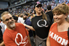 Members of QAnon await the arrival of President Donald Trump for a political rally in Wilkes-Barre, Pennsylvania on Aug. 2, 2018.