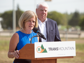 Alberta Premier Rachel Notley and Kinder Morgan Canada president Ian Anderson speak during a ground breaking ceremony at the Trans Mountain stockpile site on the Enoch Cree Nation west of Edmonton on July 27, 2018.