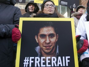 Ensaf Haidar, wife of Saudi blogger Raif Badawi, takes part in a rally for his freedom in Montreal on January 13, 2015. Saudi Arabia said Sunday it was ordering Canada’s ambassador to leave the country and freezing all new trade and investment transactions with Canada in a spat over human rights.