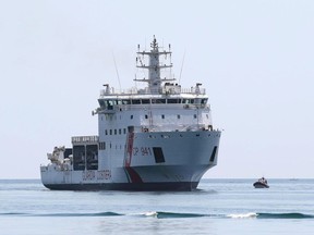 FILE  - This July 12, 2018 file photo shows the Diciotti ship of the Italian Coast Guard carrying rescued migrants as it enters the Sicilian port of Trapani, southern Italy. Interior Minister Matteo Salvini demanded Sunday, Aug. 19, 2018, that other European countries take in the 177 migrants rescued on Aug. 16 by the Diciotti after his Maltese counterpart, Michael Farrugia, insisted that the "only solution" is for the Diciotti ship to dock at the Sicilian island of Lampedusa.