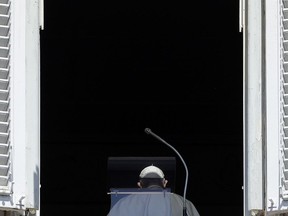 FILE - In this Sunday, Aug. 19, 2018 file photo, Pope Francis leaves his studio window overlooking St. Peter's Square at the end of the Angelus noon prayer at the Vatican. Pope Francis has issued a letter to Catholics around the world condemning the "crime" of priestly sexual abuse and cover-up and demanding accountability, in response to new revelations in the United States of decades of misconduct by the Catholic Church.