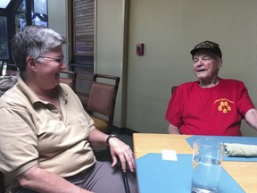 In this Monday, Aug. 13, 2018, photo Daniel Crowley, right, a 96-year-old U.S. Army Air Corps veteran from World War II who was held by Japan as a prisoner of war in the Philippines and Japan, speaks with his wife, Kelley Crowley, during an interview in Honolulu.