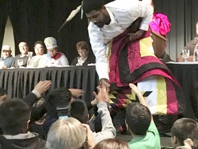Boston Celtics basketball star Kyrie Irving accepts gifts from students on the Standing Rock Indian Reservation in North Dakota on Thursday, Aug 23, 2018. Irving traveled to the reservation from which his mother came to be honored by the tribe for his heritage and his support of its battle against the Dakota Access oil pipeline.