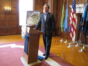 Montana Gov. Steve Bullock listens to a question during a news conference in Helena, Mont., on Tuesday, August 21, 2018. The Democrat, who is exploring a possible 2020 presidential run, stood by his comments made over the weekend that he would support a ban on some semiautomatic weapons.