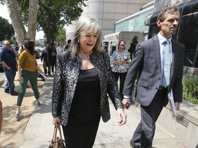 Diane Howard, the public defender for alleged serial killer Joseph James DeAngelo, walks from reporters after a court appearance in Sacramento County Superior Court, Thursday, Aug. 23, 2018, in Sacramento, Calif. DeAngelo was arraigned on 13-new rape-related charges along with 13 slayings spanning five counties committed during the 1970's and 1980's. DeAngelo did not enter a plea.