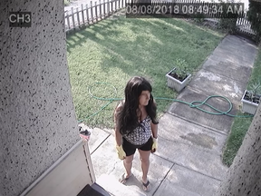 A B.C. woman checked her security cameras on her smartphone and saw a woman wearing yellow rubber gloves and a black wig standing outside her home.