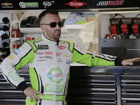 Austin Dillon leans on a tool box in the garage before a NASCAR Cup Series auto racing practice session at Darlington Raceway, Friday, Aug. 31, 2018, in Darlington, S.C.