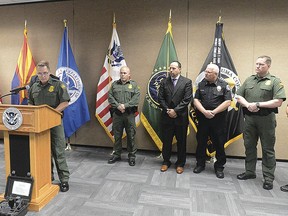 In this Wednesday, Aug. 22, 2018 photo, U.S. Border Patrol Yuma Sector Chief Patrol Agent Anthony Porvaznik, front left, talks during during a news conference at Yuma Sector U.S. Border Patrol Headquarters in Yuma, Ariz., about the recent discovery of a cross-border tunnel used to smuggle drugs in San Luis, Ariz. Federal authorities said in court documents that the tunnel was very well-built and would have taken a drug cartel a long time, and a lot of money, to dig.