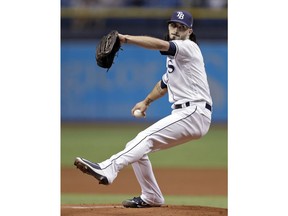 Tampa Bay Rays' Hunter Wood goes into his windup against the Kansas City Royals during the first inning of a baseball game Monday, Aug. 20, 2018, in St. Petersburg, Fla.